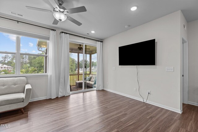 159 Wood Orchid Ln, Garner, NC 27529 - unfurnished living room with ceiling fan, baseboards, wood finished floors, and recessed lighting
