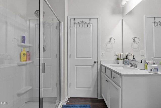 159 Wood Orchid Ln, Garner, NC 27529 - full bathroom with a stall shower, vanity, and wood finished floors