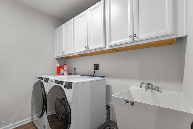 159 Wood Orchid Ln, Garner, NC 27529 - washroom featuring cabinet space, washing machine and dryer, and baseboards