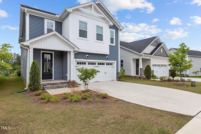 159 Wood Orchid Ln, Garner, NC 27529 - view of front of home with board and batten siding, concrete driveway, a front lawn, and an attached garage
