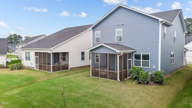 159 Wood Orchid Ln, Garner, NC 27529 - rear view of house featuring a sunroom, roof with shingles, and a lawn