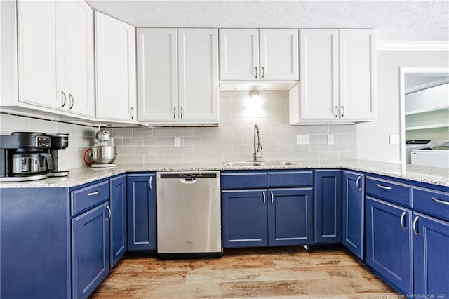 750 Magellan Ct, Fayetteville, NC 28311 - kitchen featuring stainless steel dishwasher, blue cabinetry, a textured ceiling, white cabinets, and backsplash