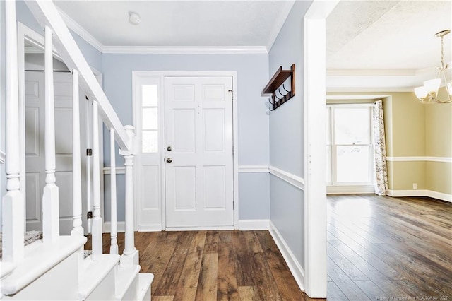 750 Magellan Ct, Fayetteville, NC 28311 - entryway featuring a chandelier, dark wood-type flooring, ornamental molding, and stairs
