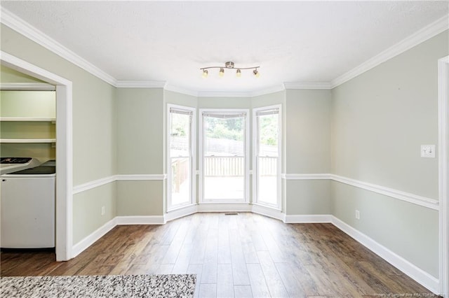 750 Magellan Ct, Fayetteville, NC 28311 - unfurnished room with washer / dryer, wood finished floors, and ornamental molding