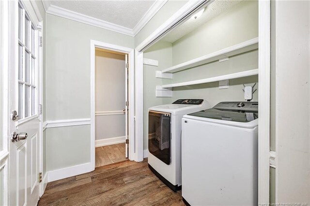 750 Magellan Ct, Fayetteville, NC 28311 - laundry room featuring independent washer and dryer, ornamental molding, and wood finished floors
