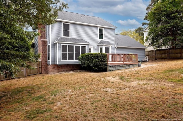 750 Magellan Ct, Fayetteville, NC 28311 - rear view of house with a deck, a fenced backyard, and a shingled roof