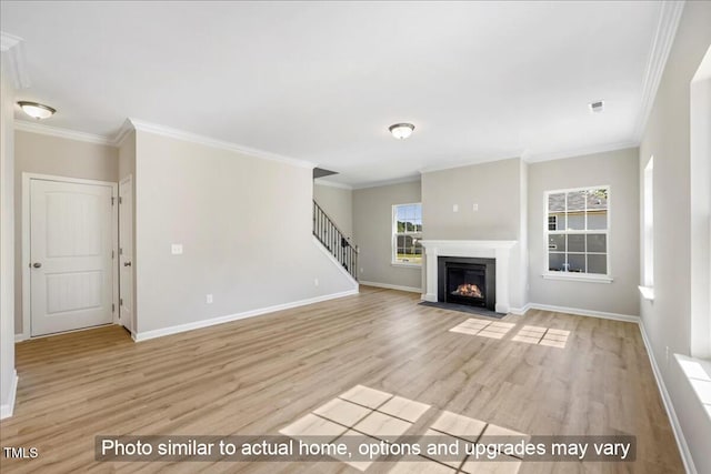 1406 Reading Ct Unit 93Kl, Burlington, NC 27217 - unfurnished living room featuring crown molding, light wood-style flooring, stairs, baseboards, and a fireplace with flush hearth