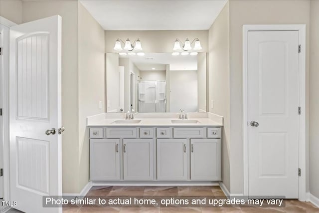 1406 Reading Ct Unit 93Kl, Burlington, NC 27217 - bathroom with baseboards, double vanity, and a shower