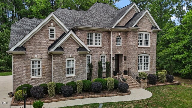 3323 Cheswick Dr, Raleigh, NC 27609 - view of front of house with roof with shingles and brick siding