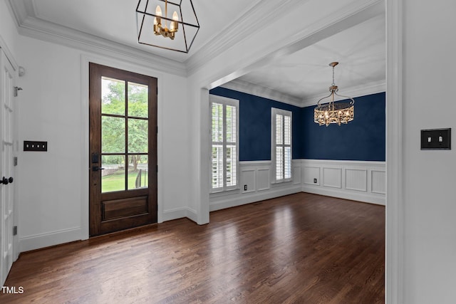 3323 Cheswick Dr, Raleigh, NC 27609 - entryway with a chandelier, healthy amount of natural light, dark wood-type flooring, ornamental molding, and wainscoting