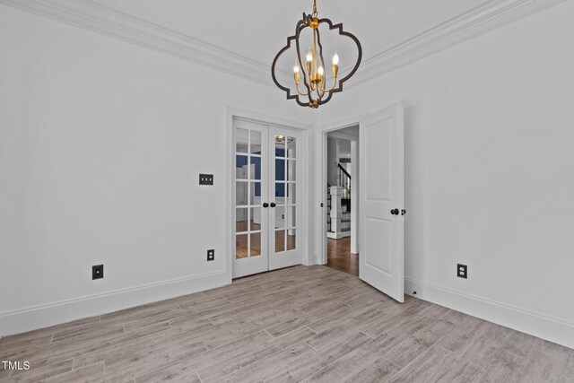 3323 Cheswick Dr, Raleigh, NC 27609 - unfurnished room with french doors, ornamental molding, a chandelier, light wood-type flooring, and stairway