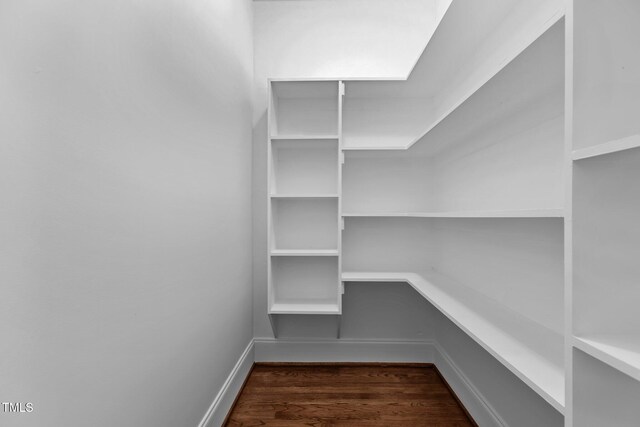 3323 Cheswick Dr, Raleigh, NC 27609 - walk in closet with dark wood-type flooring
