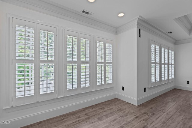 3323 Cheswick Dr, Raleigh, NC 27609 - spare room featuring baseboards, ornamental molding, wood finished floors, and recessed lighting