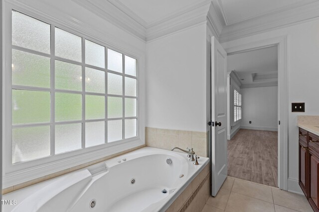 3323 Cheswick Dr, Raleigh, NC 27609 - bathroom with crown molding, a jetted tub, tile patterned floors, and vanity