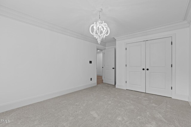 3323 Cheswick Dr, Raleigh, NC 27609 - unfurnished bedroom with a chandelier, carpet flooring, ornamental molding, a closet, and baseboards