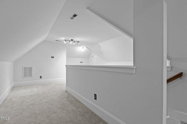 3323 Cheswick Dr, Raleigh, NC 27609 - bonus room featuring lofted ceiling, carpet, and baseboards