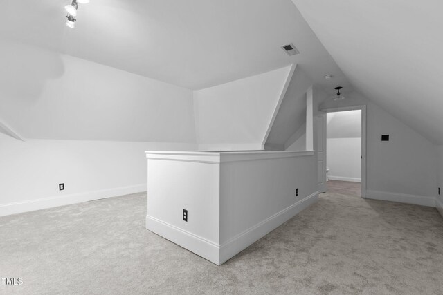 3323 Cheswick Dr, Raleigh, NC 27609 - bonus room featuring carpet, lofted ceiling, and baseboards