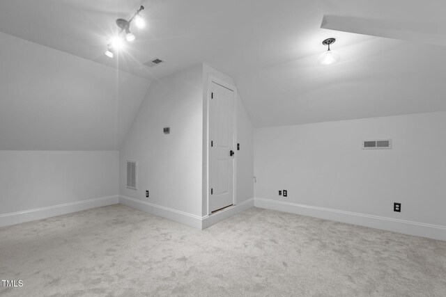 3323 Cheswick Dr, Raleigh, NC 27609 - additional living space featuring vaulted ceiling, carpet, and baseboards