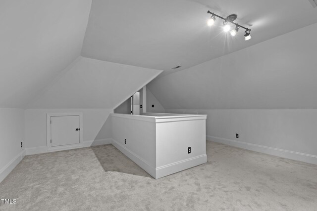 3323 Cheswick Dr, Raleigh, NC 27609 - additional living space with carpet flooring, lofted ceiling, and baseboards