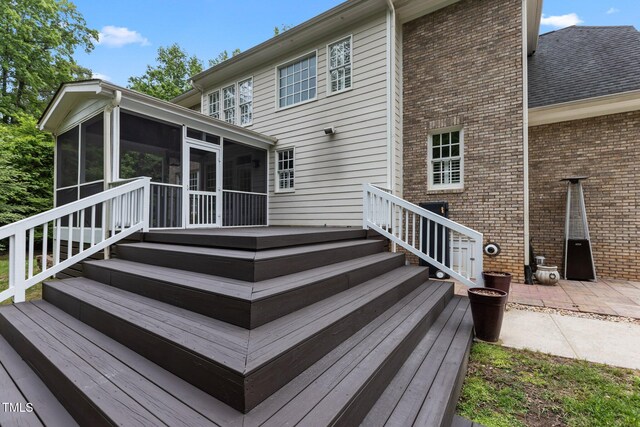 3323 Cheswick Dr, Raleigh, NC 27609 - wooden terrace with a sunroom and a patio area