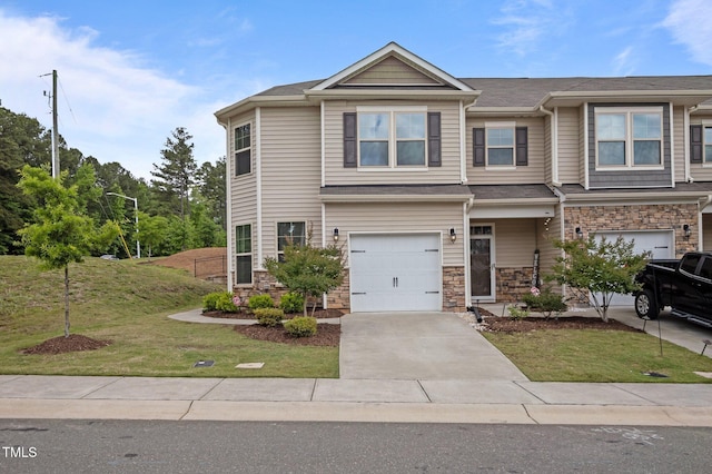 view of front of house featuring a garage, stone siding, a front lawn, and driveway