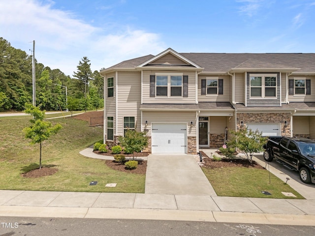 view of front of property with a garage, a front lawn, and concrete driveway