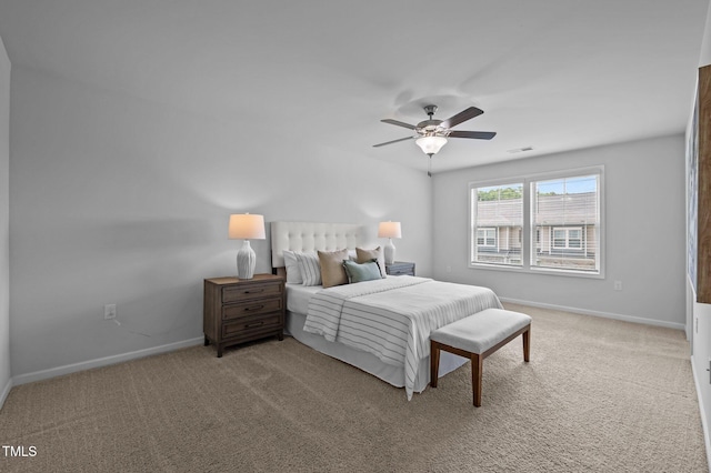 carpeted bedroom with baseboards and ceiling fan