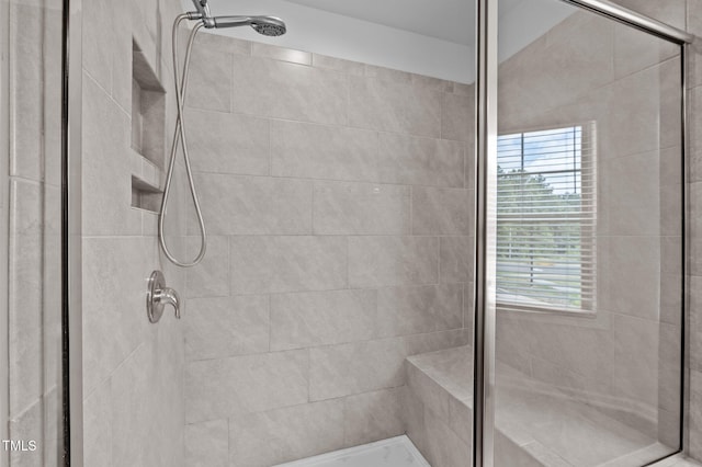 full bath featuring a shower stall