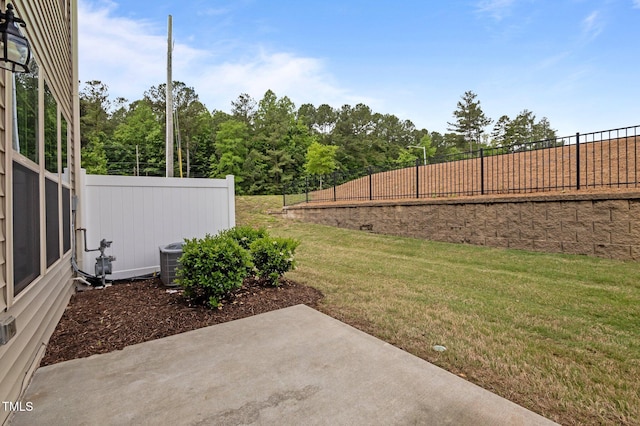 view of yard featuring a patio area and central AC