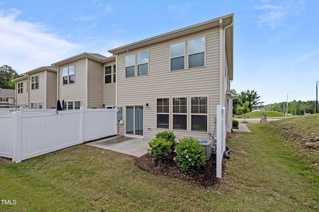 rear view of house with a patio and central air condition unit