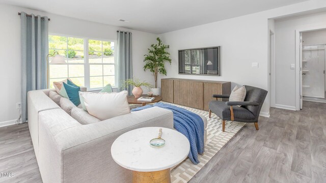 209 Wood St, La Grange, NC 28551 - living area with light wood-type flooring and baseboards