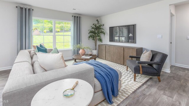 209 Wood St, La Grange, NC 28551 - living area with wood finished floors and baseboards