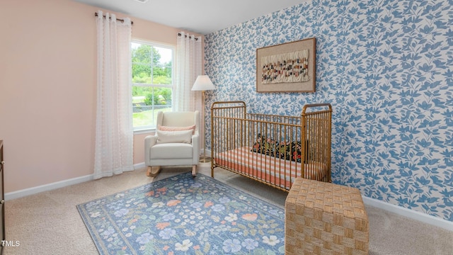209 Wood St, La Grange, NC 28551 - carpeted bedroom featuring wallpapered walls, baseboards, and a crib