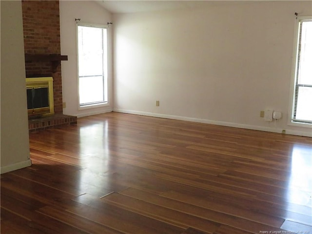 5609 Bowman Ct, Fayetteville, NC 28304 - unfurnished living room featuring healthy amount of natural light, wood finished floors, and baseboards