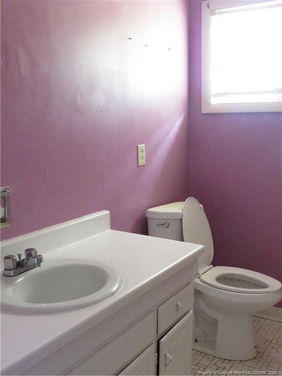 5609 Bowman Ct, Fayetteville, NC 28304 - bathroom with toilet, vanity, and tile patterned flooring