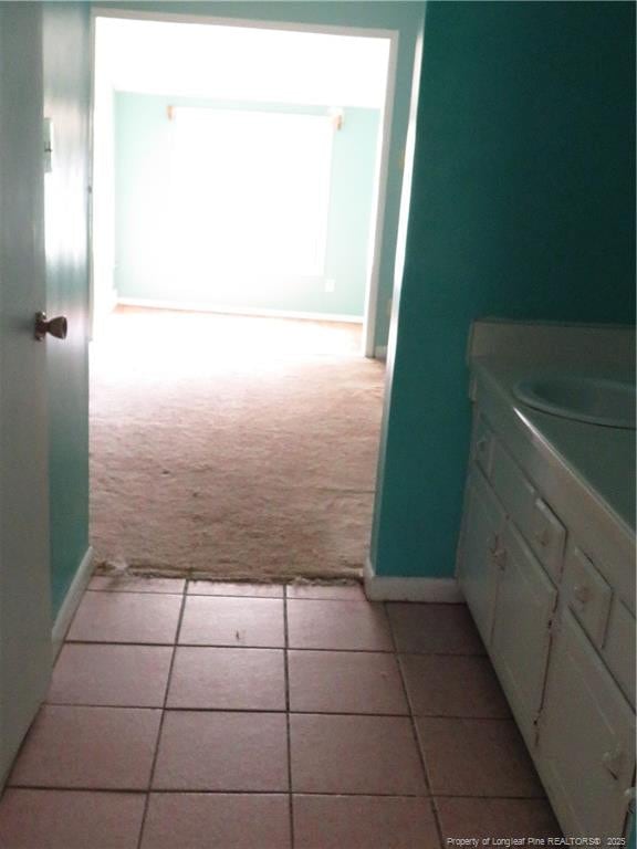5609 Bowman Ct, Fayetteville, NC 28304 - bathroom with baseboards, tile patterned flooring, and vanity