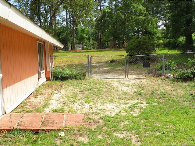 5609 Bowman Ct, Fayetteville, NC 28304 - view of yard featuring view of scattered trees and a gate