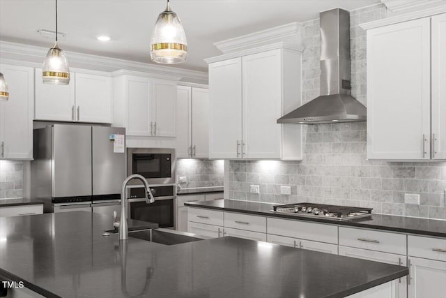 131 English Violet Ln, Raleigh, NC 27610 - kitchen featuring wall chimney exhaust hood, a sink, stainless steel appliances, dark countertops, and ornamental molding