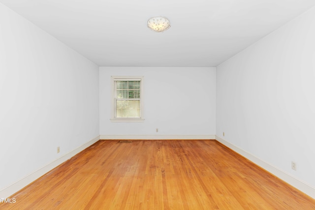 411 W Killiegrey St, Lillington, NC 27546 - spare room with light wood-style flooring and baseboards