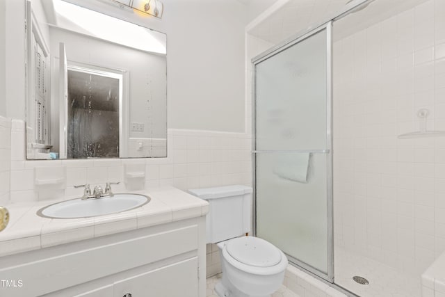 411 W Killiegrey St, Lillington, NC 27546 - full bath with a shower stall, vanity, toilet, tile walls, and wainscoting