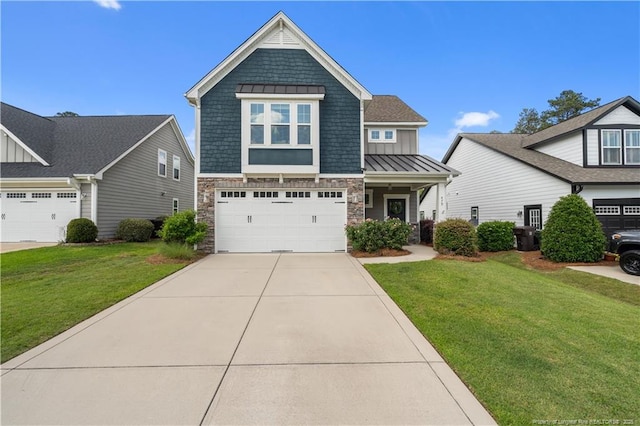 craftsman house with a standing seam roof, board and batten siding, stone siding, a front yard, and driveway
