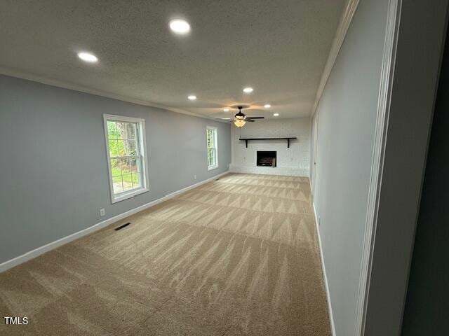 65 Prospect Church Rd, Erwin, NC 28339 - unfurnished living room featuring light colored carpet, recessed lighting, baseboards, ceiling fan, and a fireplace