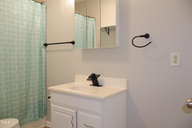 1536 Granville St, Burlington, NC 27215 - bathroom with curtained shower, toilet, and vanity