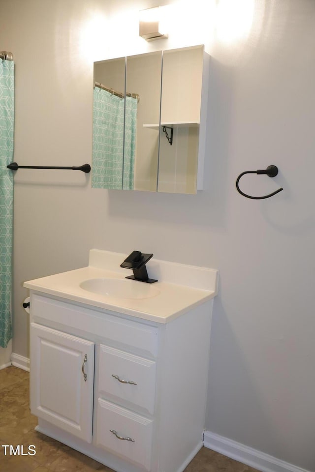1536 Granville St, Burlington, NC 27215 - full bathroom featuring vanity and baseboards