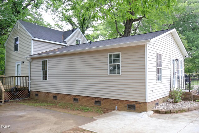 1536 Granville St, Burlington, NC 27215 - view of side of home with crawl space and a patio area