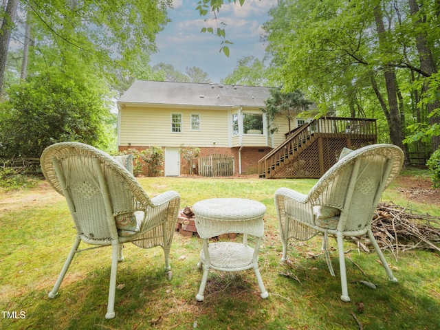 4 Barkridge Ct, Durham, NC 27713 - back of property with stairway, a wooden deck, and a lawn