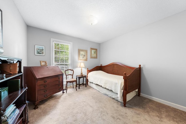 4 Barkridge Ct, Durham, NC 27713 - bedroom featuring carpet flooring, a textured ceiling, and baseboards