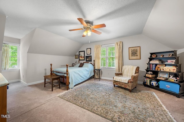 4 Barkridge Ct, Durham, NC 27713 - carpeted bedroom with lofted ceiling, multiple windows, baseboards, a ceiling fan, and a textured ceiling