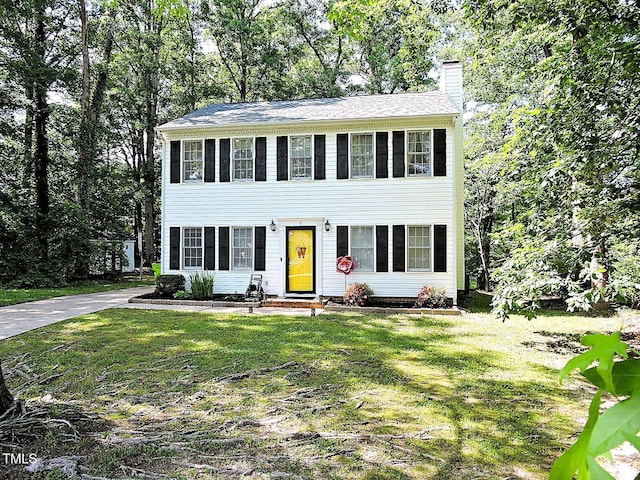 8 Woodsprite Ct, Durham, NC 27703 - colonial home featuring entry steps, a chimney, and a front yard