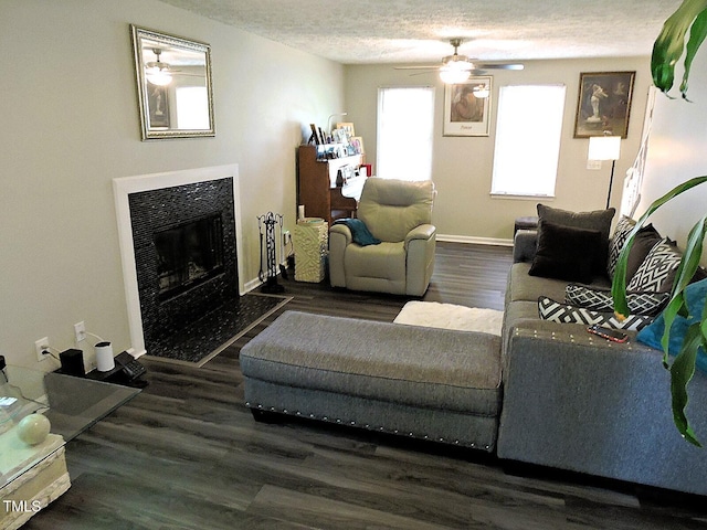 8 Woodsprite Ct, Durham, NC 27703 - living area with a ceiling fan, wood finished floors, a fireplace, baseboards, and a textured ceiling